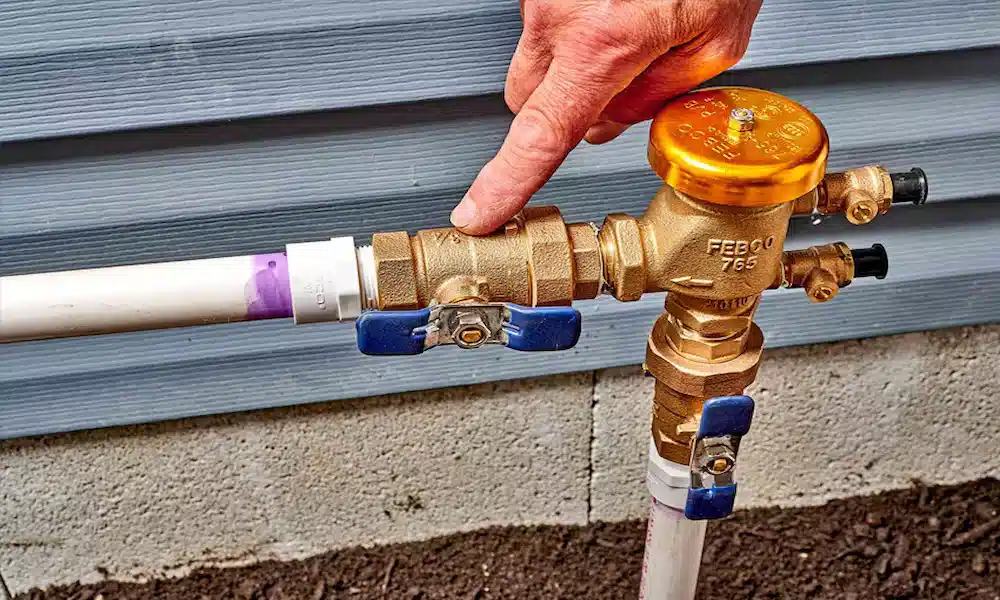 Pressure vacuum breaker (PVB) backflow preventer test above grade on a residential irrigation supply line