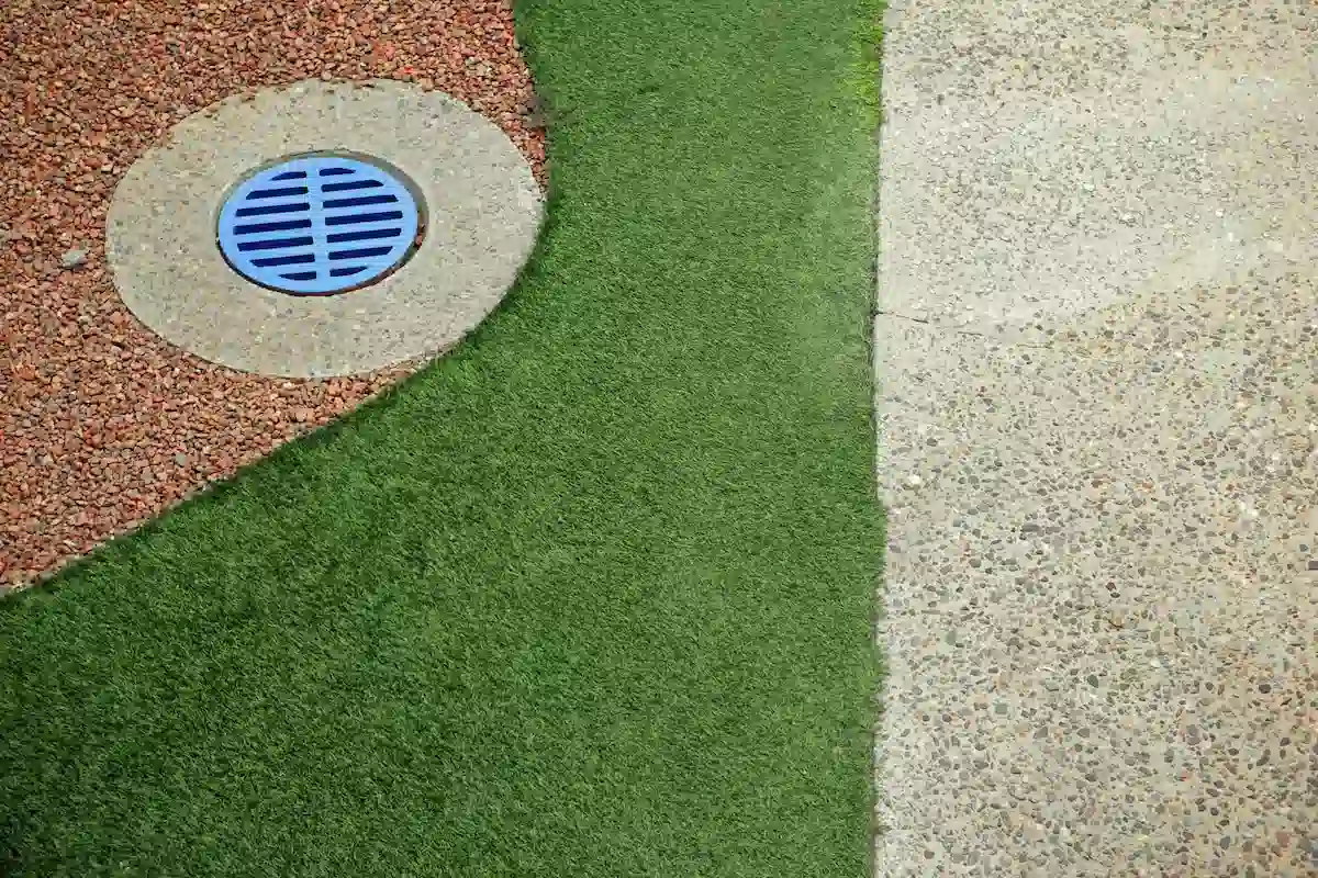 green grass rocks and concrete background